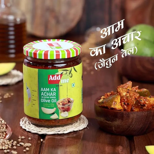 Jar of Adda Me Aam Ka Achar on a wooden table with text in Hindi.