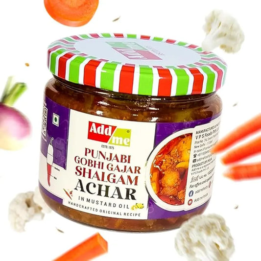 Jar of Add Me Punjabi Gobhi Gajar Shalgam Achar with colorful lid and ingredients around on a white background