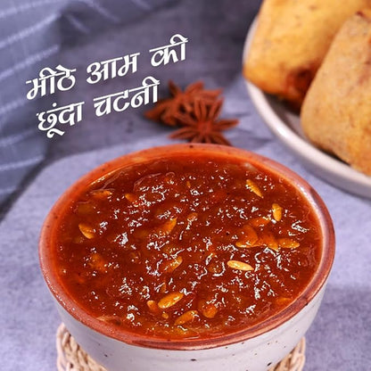 Red chutney in a white bowl with text on a gray background