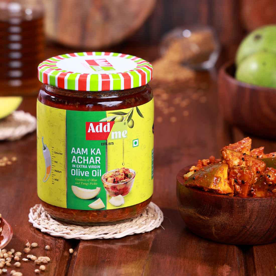 Add Me Foods: Jar of Adda Me Aam Ka Achar on a wooden table with ingredients around