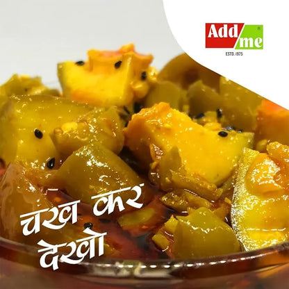 Mango pickle in a glass bowl with 'Add Me' logo in the corner