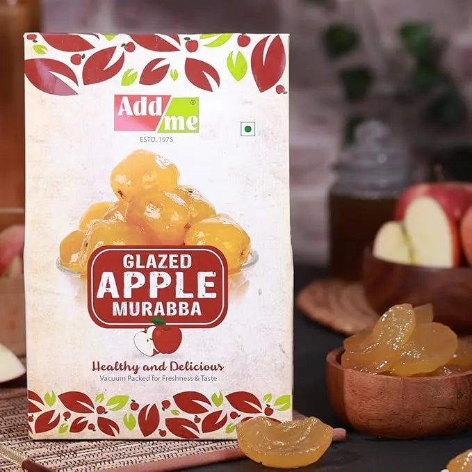 Packaging of Add Me Glazed Apple Murabba with apples and a bowl in the background