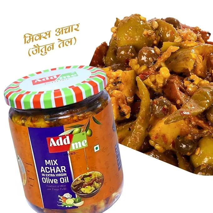 Jar of Add Me Mix Achar with a dish of mixed vegetables on a white background