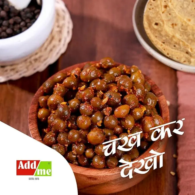 RajasthaniKairTentiPickle300gm: Wooden bowl of green lentils with text and AddMe logo on a wooden surface