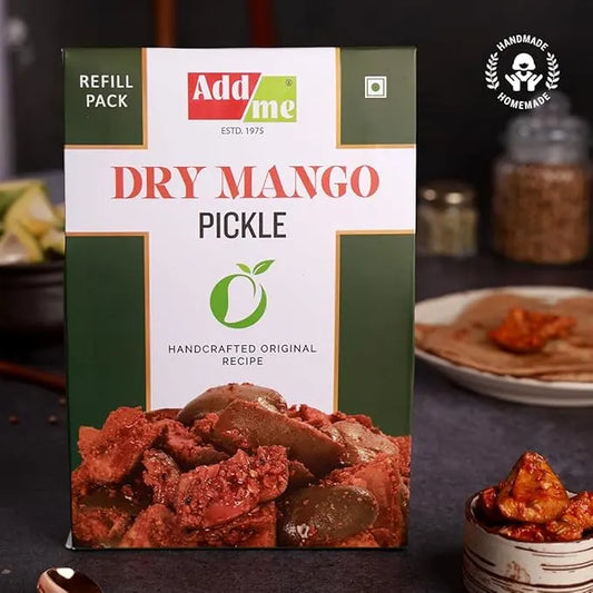 Addme Dry Mango Pickle packaging with ingredients in the background