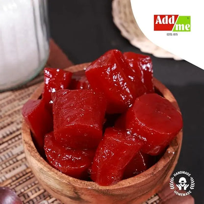 Add Me Foods: Wooden bowl filled with red gummy bears on a woven mat, with 'Add me' brand logo in the corner.