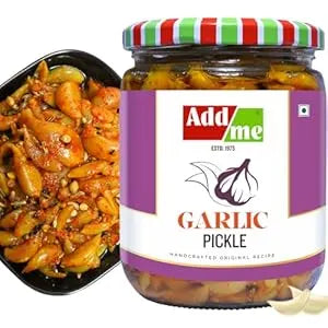 Add Me Foods: Jar of garlic pickle with a container of pickled vegetables on a white background