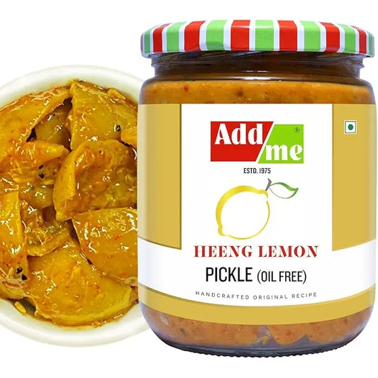 Jar of Add Me Heeng Lemon Pickle with a bowl of pickles on a white background