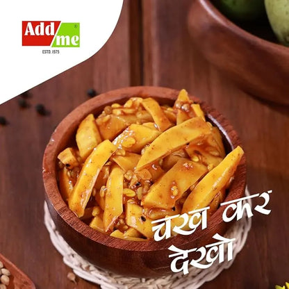 Wooden bowl of yellow vegetable dish with 'Add Me' logo and text in a foreign language.