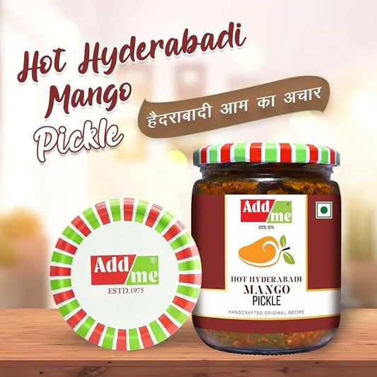 Jar of Addme Hot Hyderabadi Mango Pickle with decorative elements on a wooden surface.