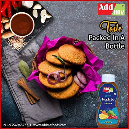 Basket of cookies with a bottle of Add Me mixed pickle on a dark surface