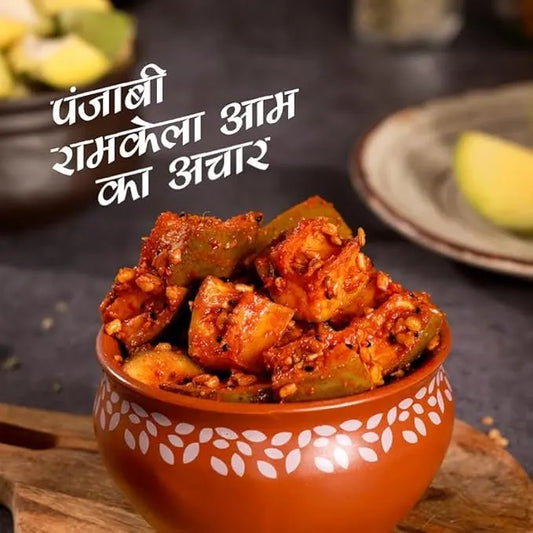 Spicy vegetable dish in an orange bowl with text in a foreign language on a dark background