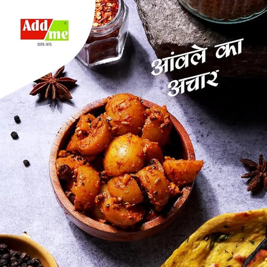 Wooden bowl of potato dish with spices and 'Addme' branding on a gray surface