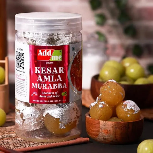 Add Me Foods: Jar of Kesar Amla Murabba with a bowl of fruit on a table